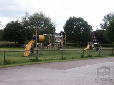 Children playing in the village playing field [152]